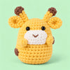 Honey Giraffe: a golden yellow giraffe with small brown horns and a gentle face