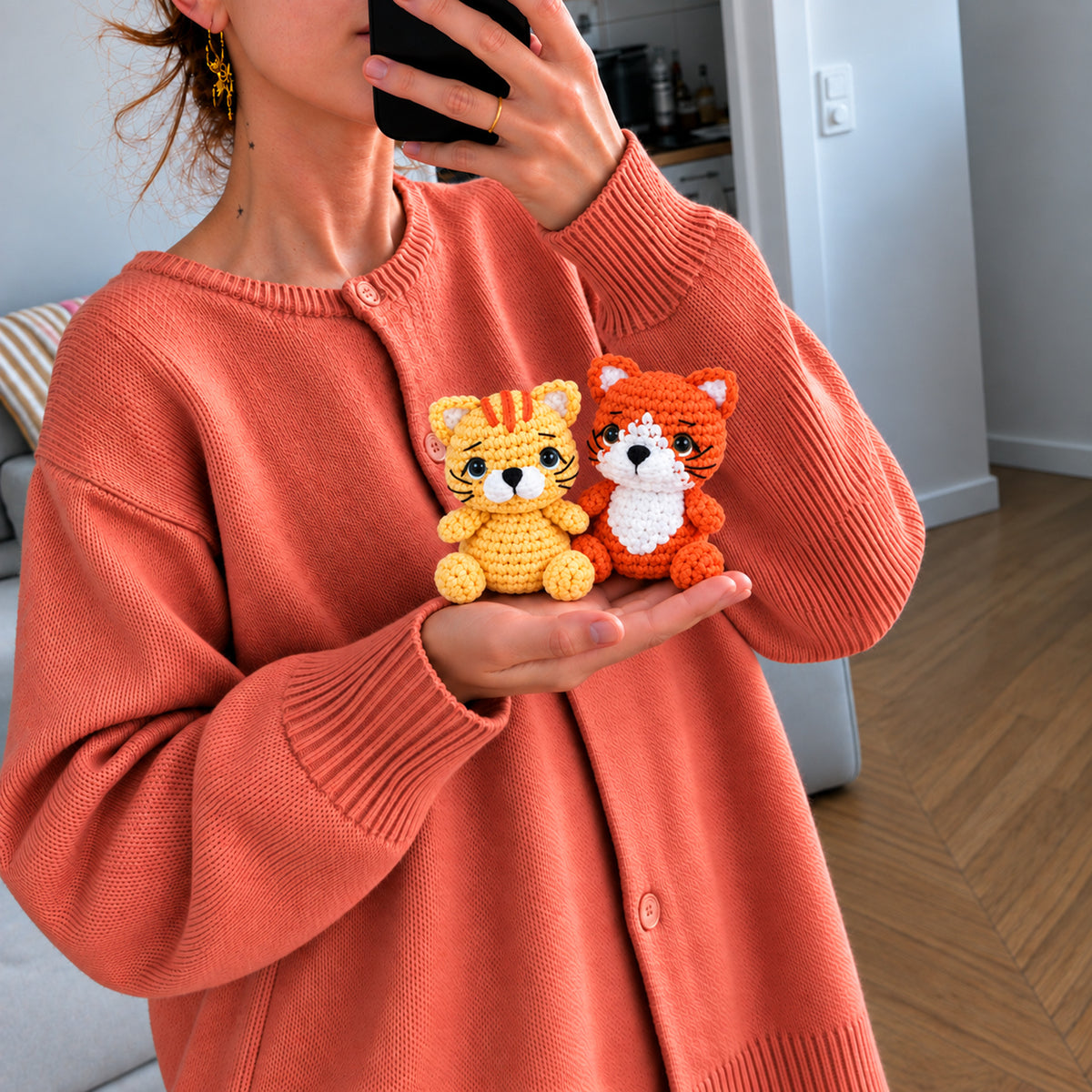 Pocket Fox and Cat: an orange fox and a golden cat with small embroidered details, shown in hand