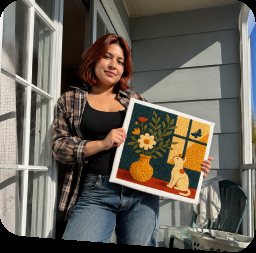 Crafter holding a colorful flower artwork