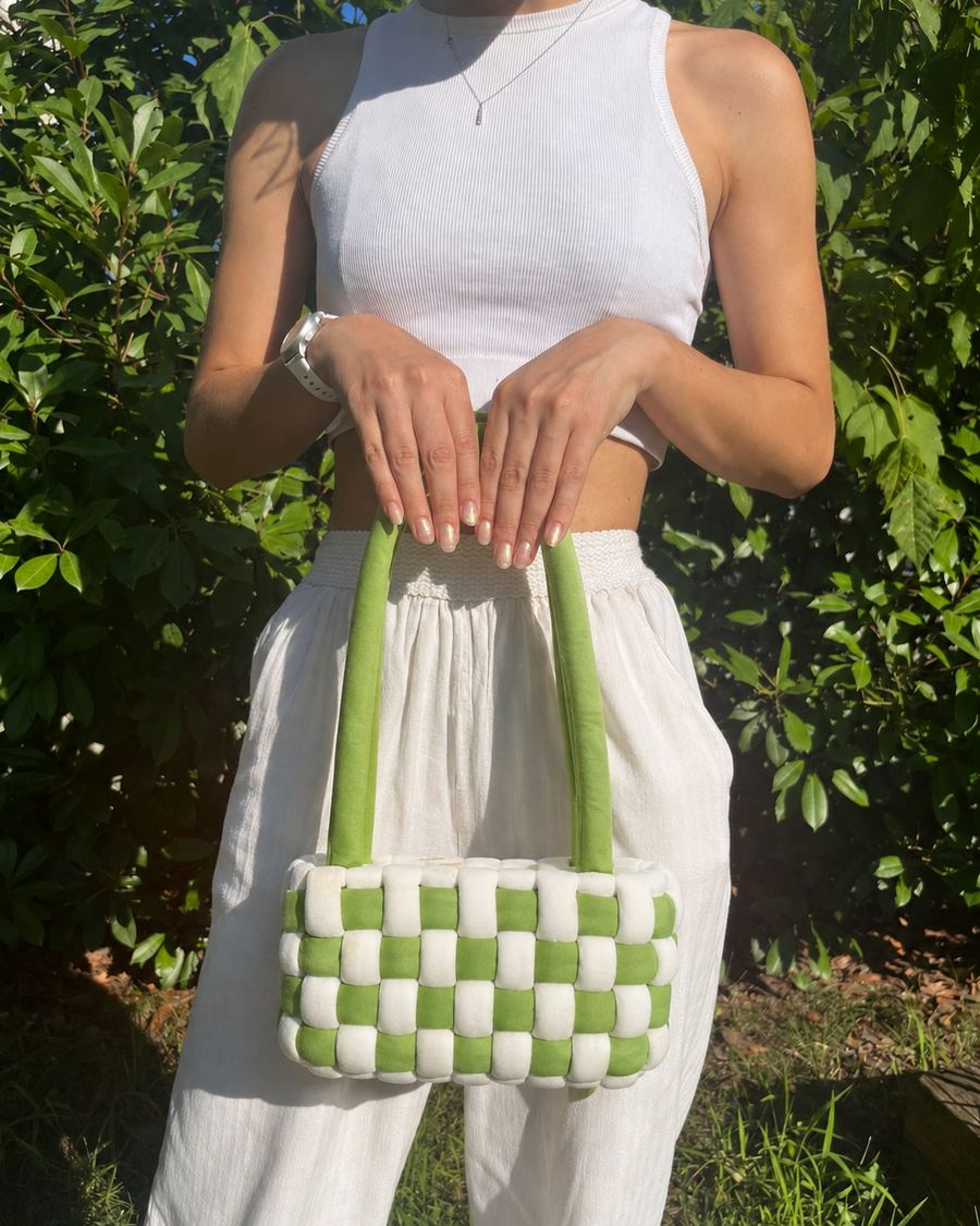 Close view of a handmade green crochet bag