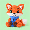 Autumn Scarf Fox: an orange fox wrapped in a bright blue scarf