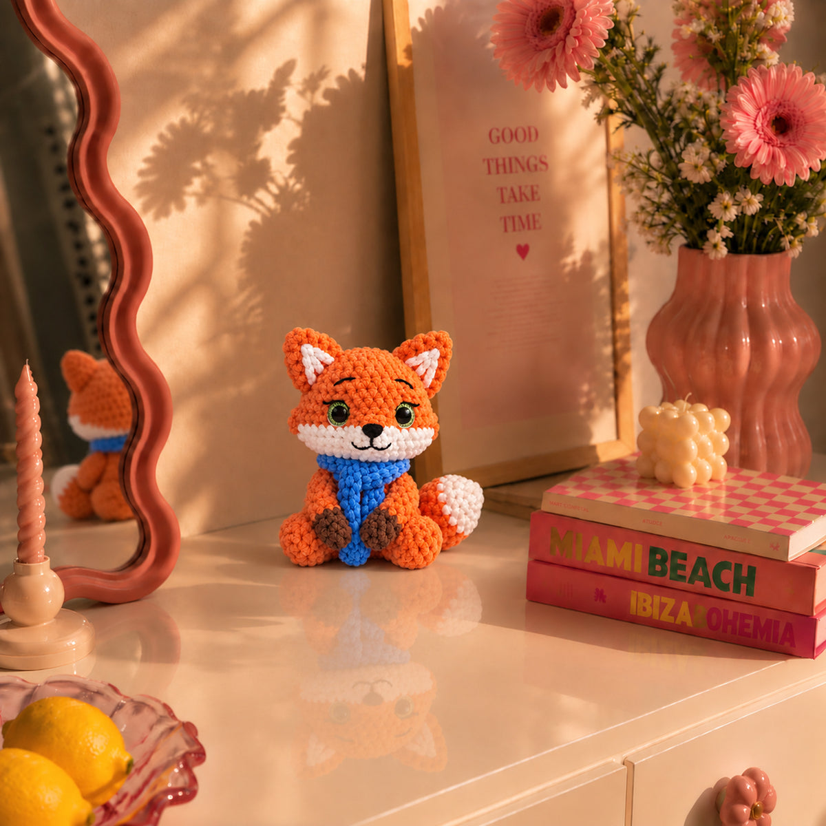 Autumn Scarf Fox: an orange fox wrapped in a bright blue scarf, displayed in an interior setting