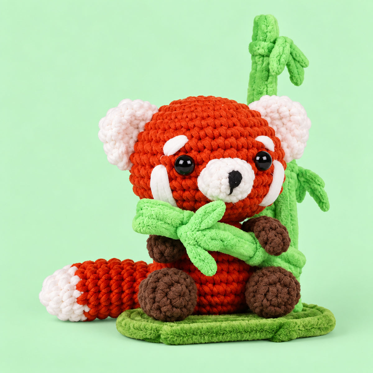 Bamboo Red Panda: a red panda holding a little green bamboo sprig