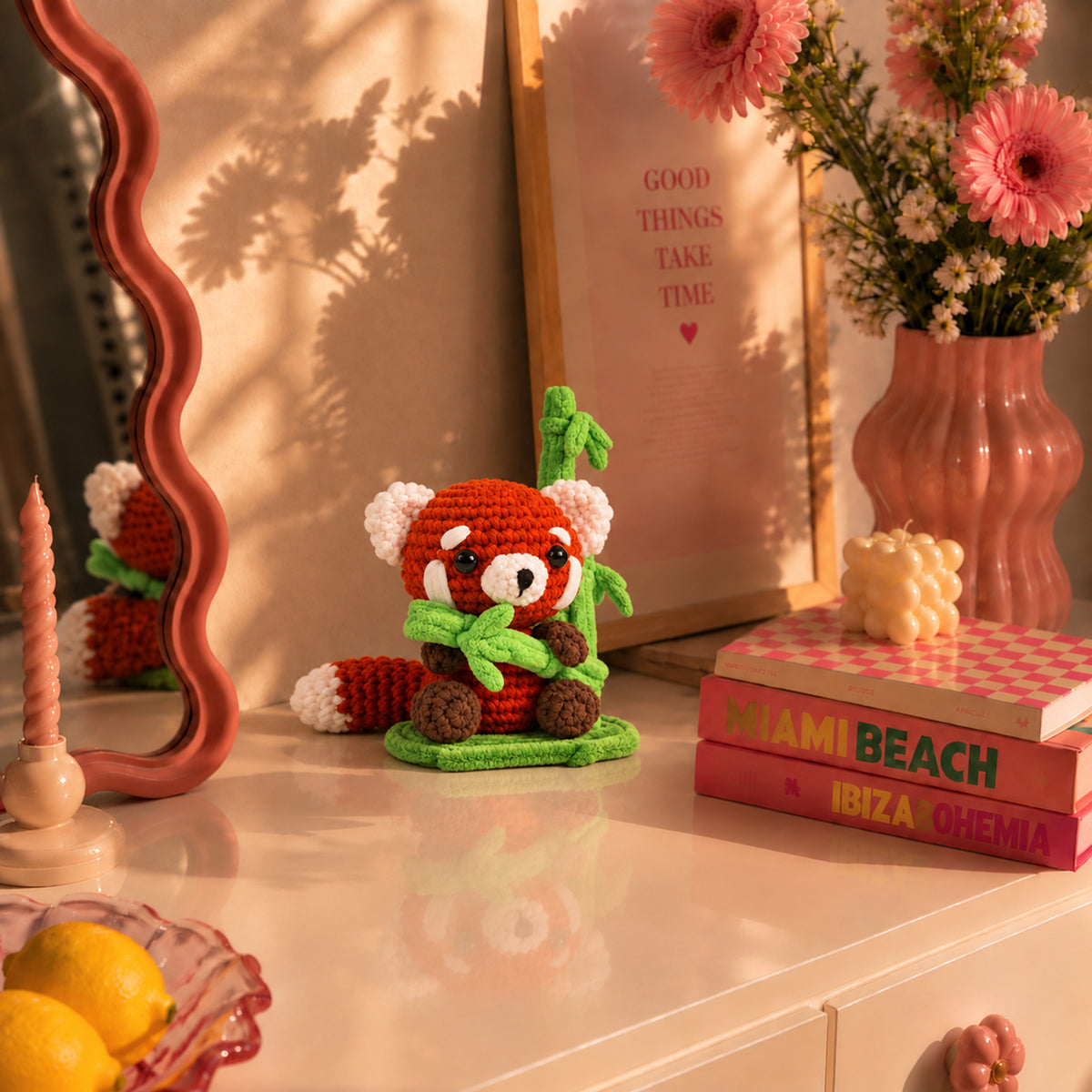 Bamboo Red Panda: a red panda holding a little green bamboo sprig, displayed in an interior setting