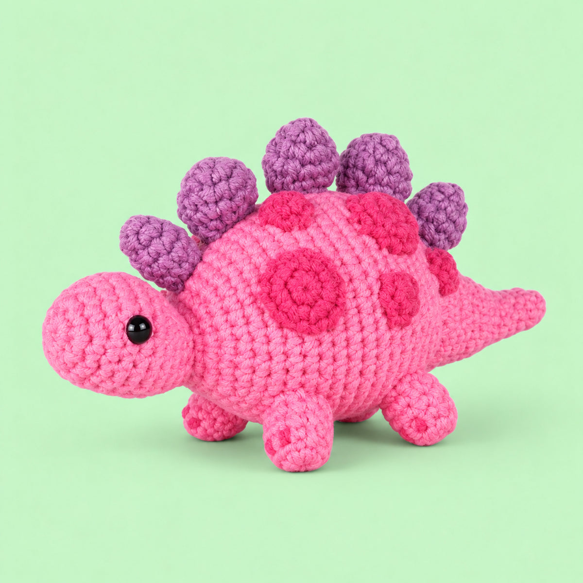 Berry Little Dino: a berry pink dinosaur with purple plates along its back