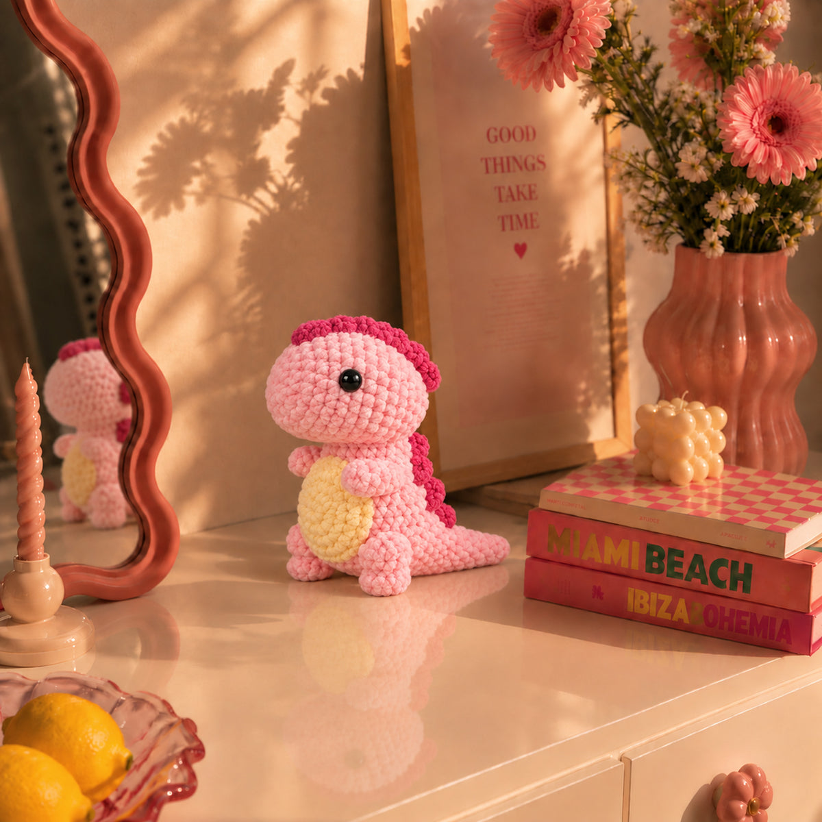 Blossom Little Dino: a pink standing dinosaur with a cream belly, displayed in an interior setting