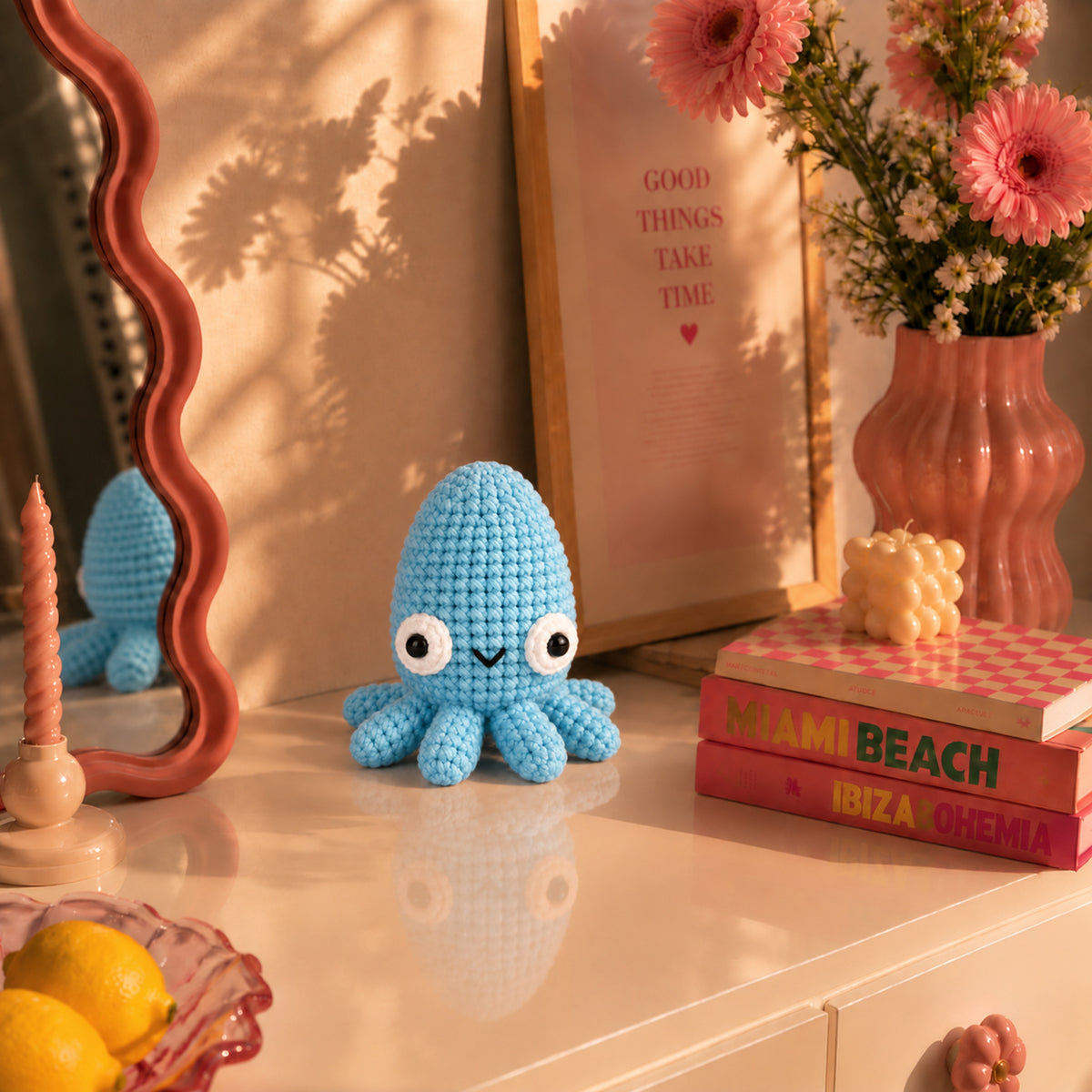 Blue Tide Cuttlefish: a sky blue cuttlefish with a rounded head and smiling face, displayed in an interior setting