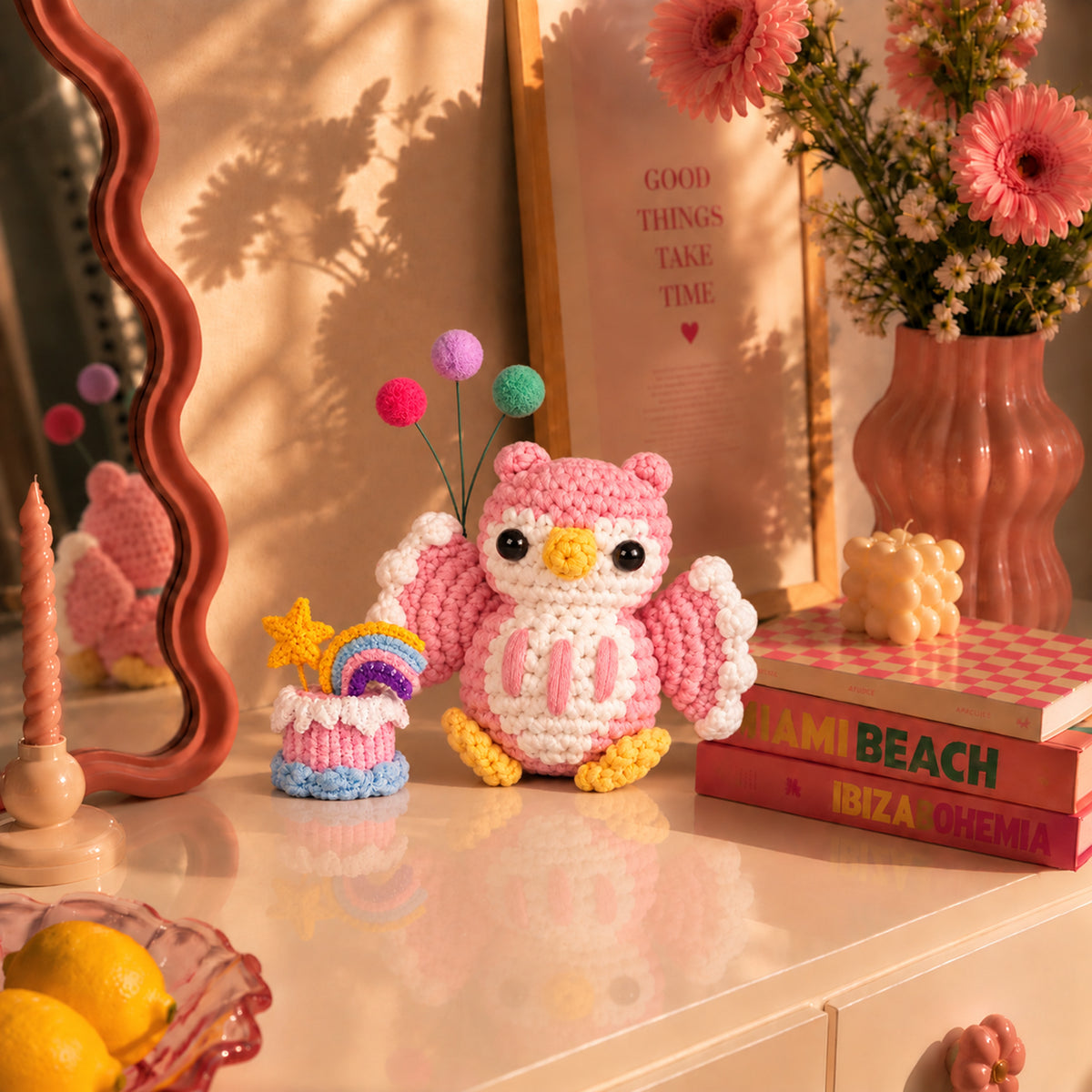 Blush Birthday Owl: a blush pink birthday owl with a cake and balloon details, displayed in an interior setting