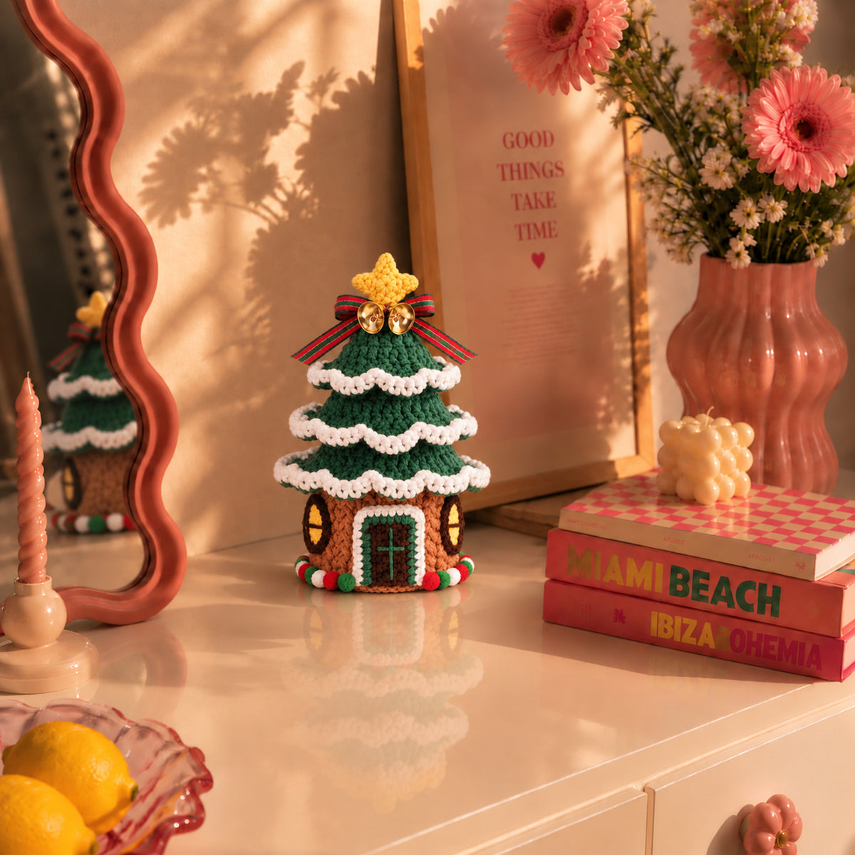 Christmas Tree Cottage: a decorated tree with a small cottage at its base, displayed in an interior setting