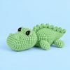 Clover Crocodile: a green crocodile with a rounded snout and a row of small back scales