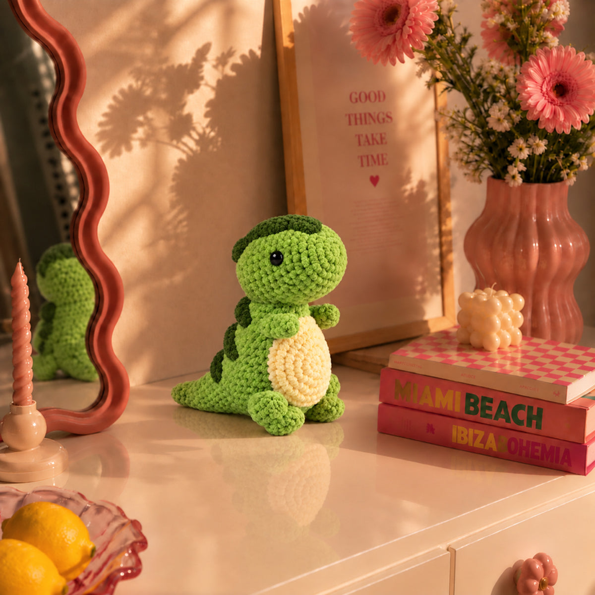 Clover Little Dino: a green standing dinosaur with a cream belly, displayed in an interior setting