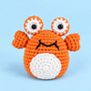 Coral Pop Crab: an orange crab with tall eyes and small raised claws