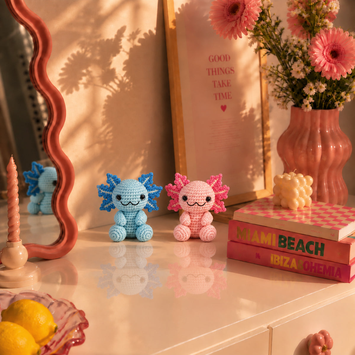Cotton Candy Axolotls: pink and blue axolotls with delicate frilly gills, displayed in an interior setting