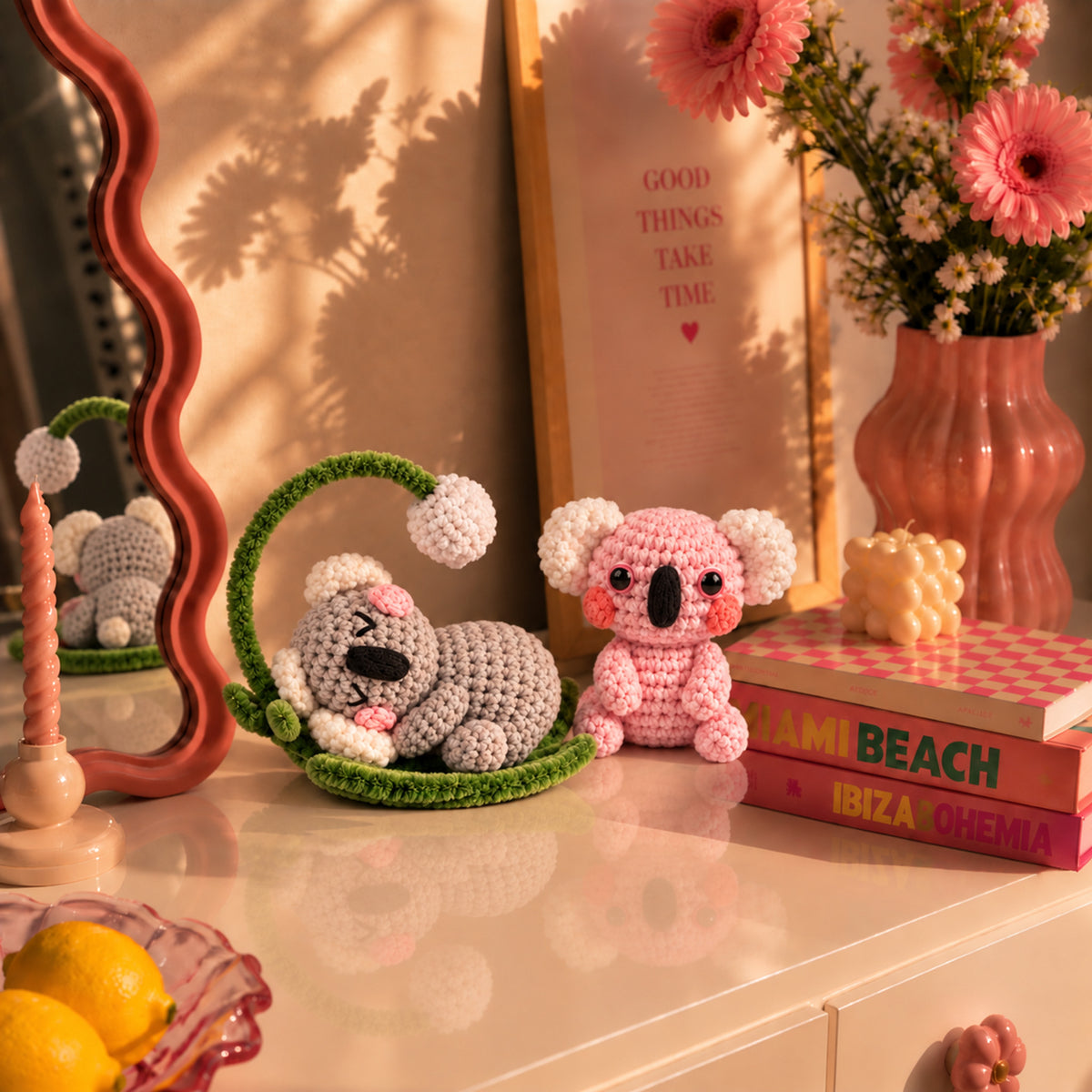 Dreamy Koala Pals: a grey koala resting in a curved branch beside a pink koala, displayed in an interior setting