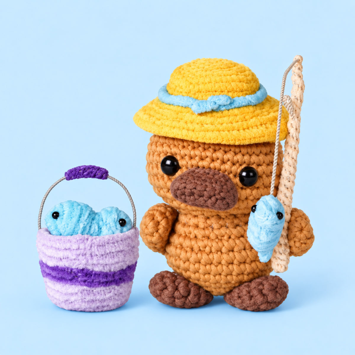Gone Fishing Platypus: a platypus in a yellow hat with a small fish and bucket