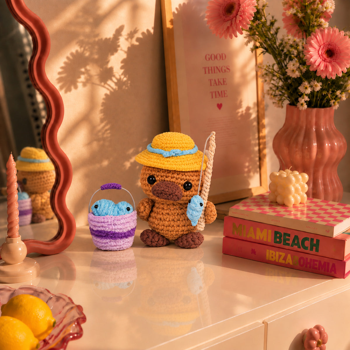 Gone Fishing Platypus: a platypus in a yellow hat with a small fish and bucket, displayed in an interior setting