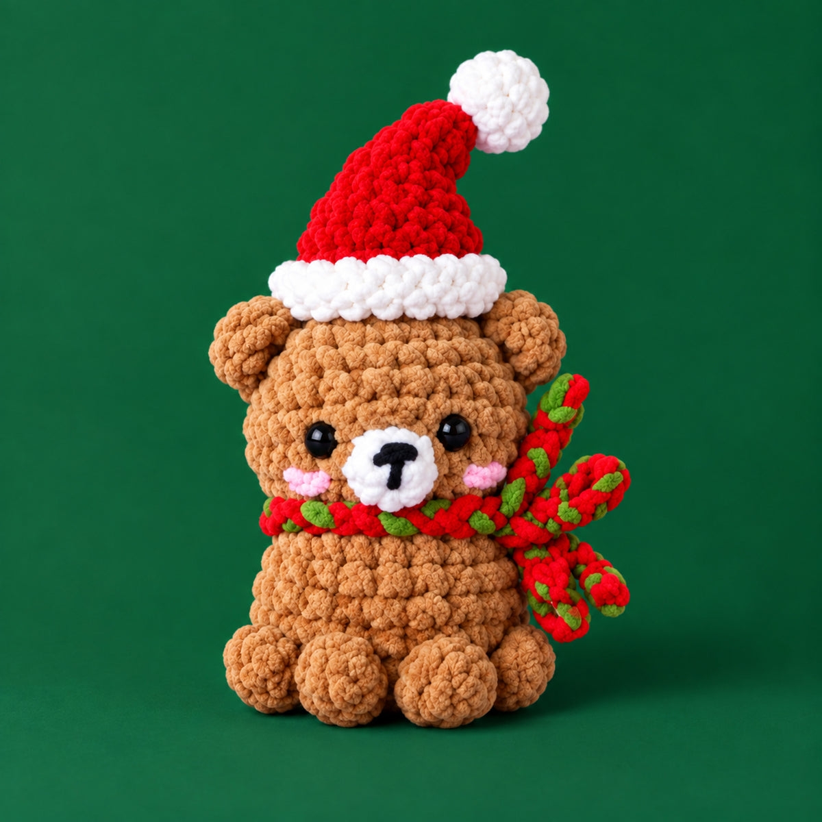 Holly Hug Bear: a brown bear in a Santa hat and festive scarf