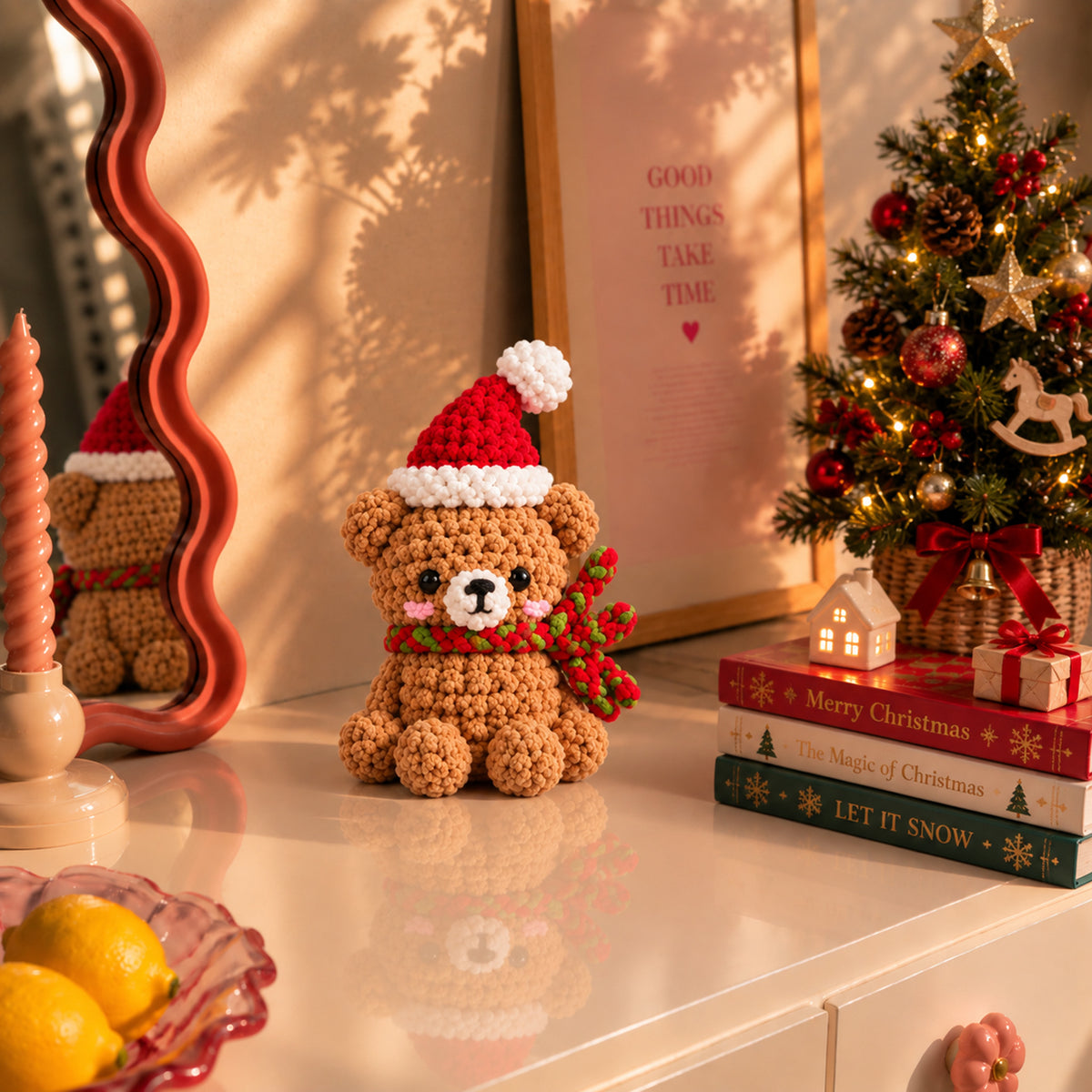 Holly Hug Bear: a brown bear in a Santa hat and festive scarf, displayed in an interior setting