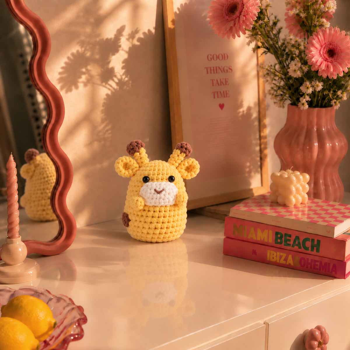 Honey Giraffe: a golden yellow giraffe with small brown horns and a gentle face, displayed in an interior setting