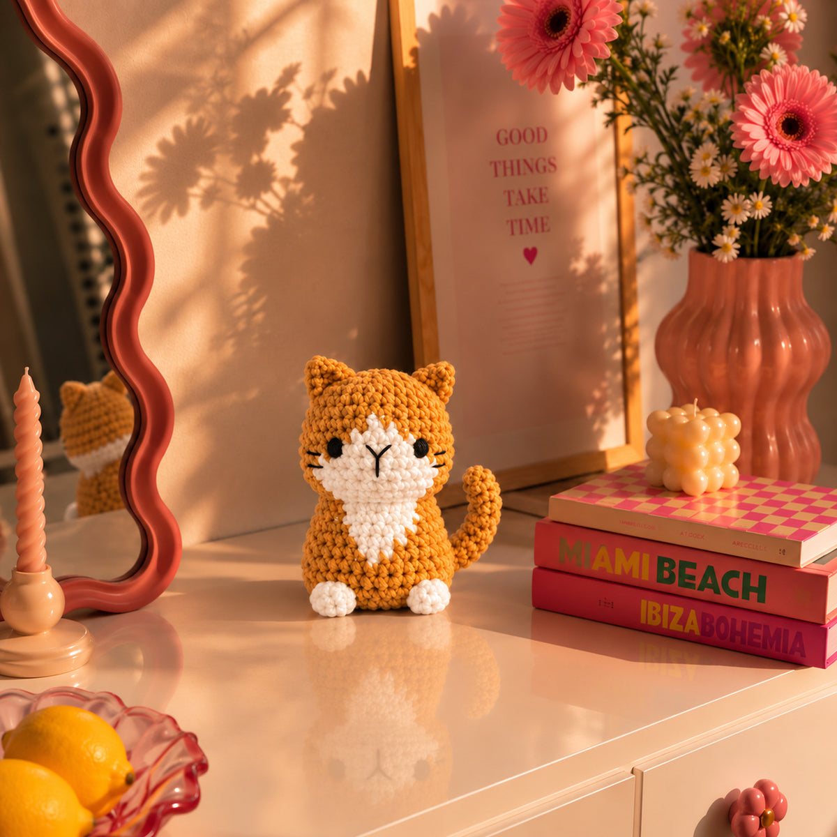 Honey Tabby: a honey-coloured cat with a white chest and a curled tail, displayed in an interior setting
