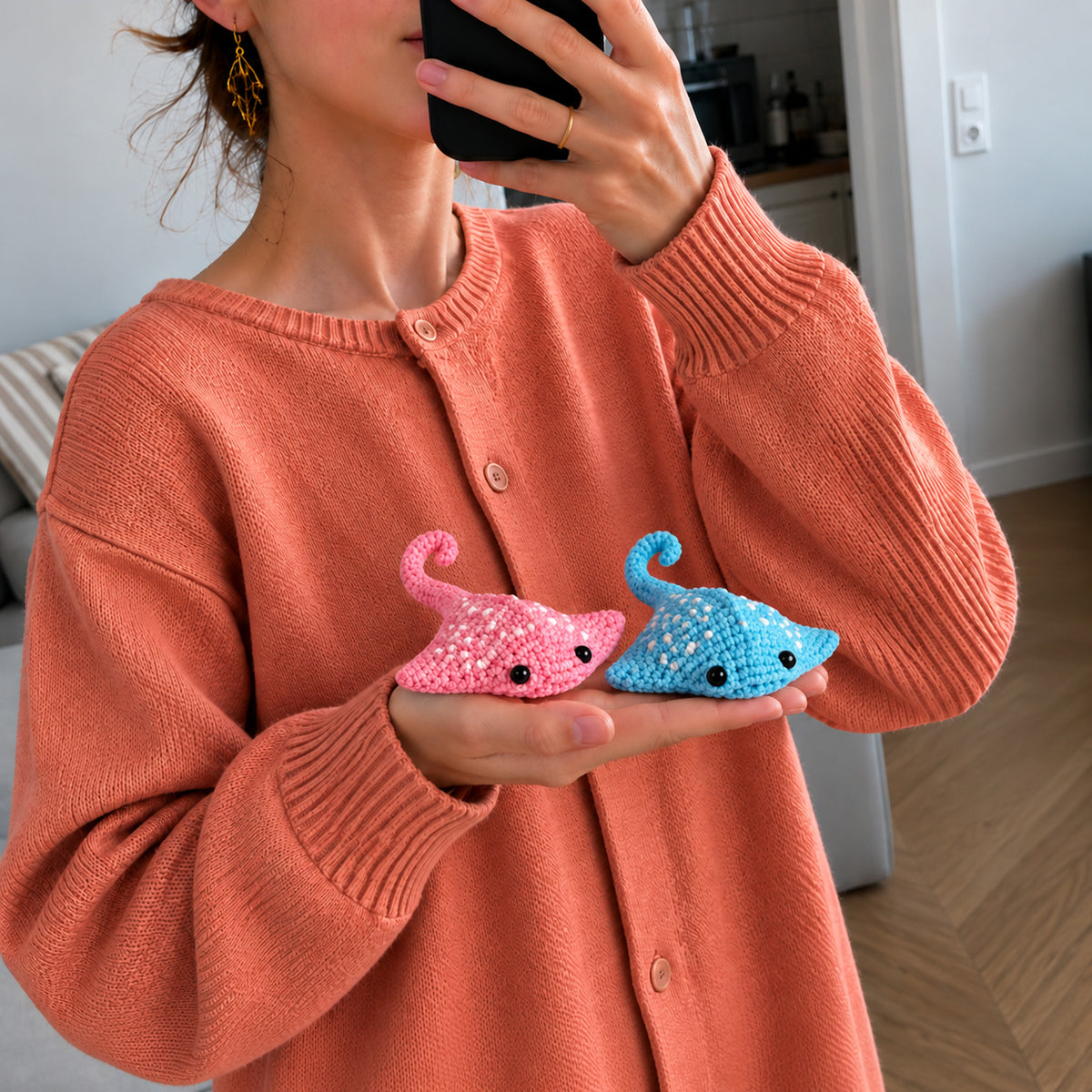 Lagoon Ray Pals: pink and turquoise manta rays with dotted details, shown in hand