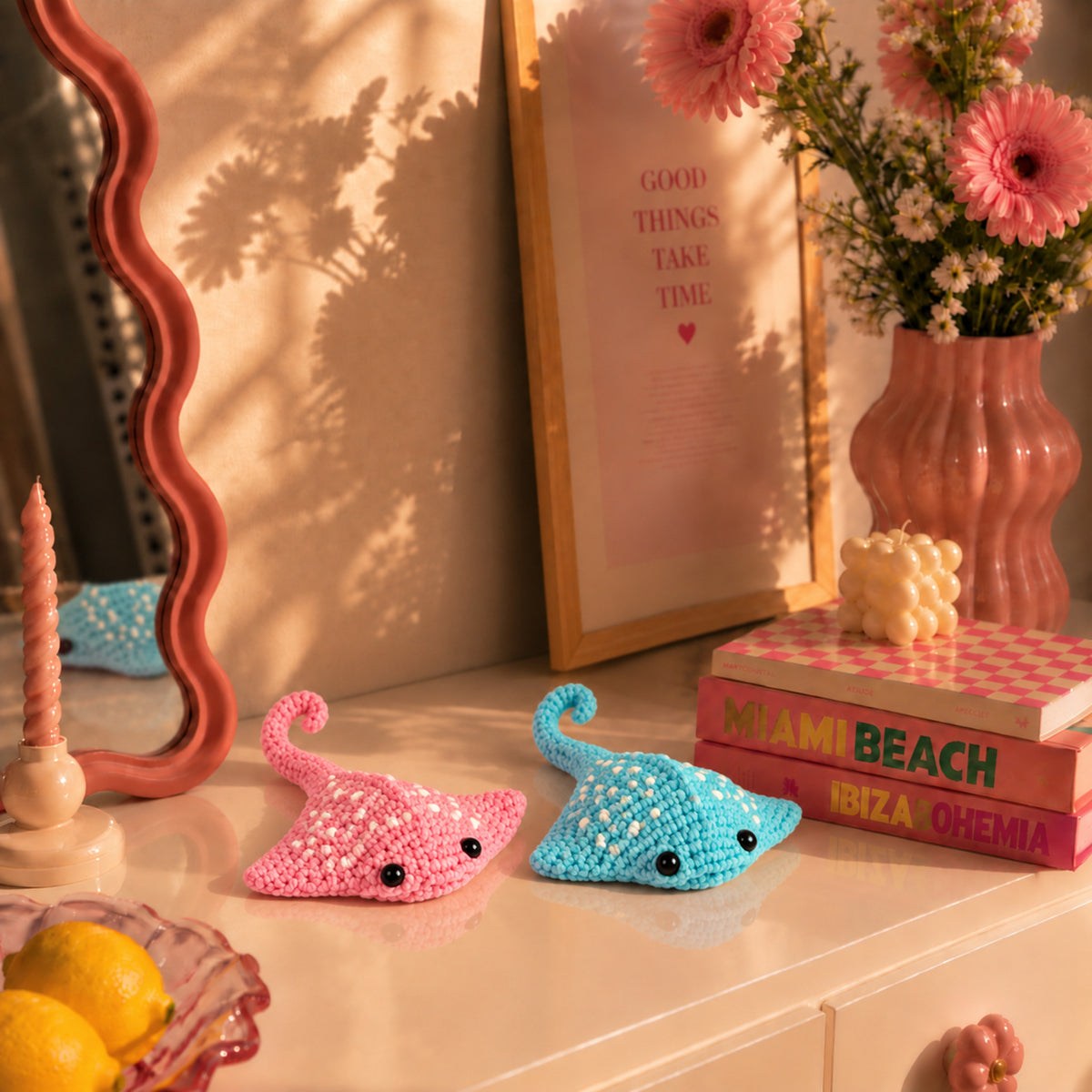 Lagoon Ray Pals: pink and turquoise manta rays with dotted details, displayed in an interior setting