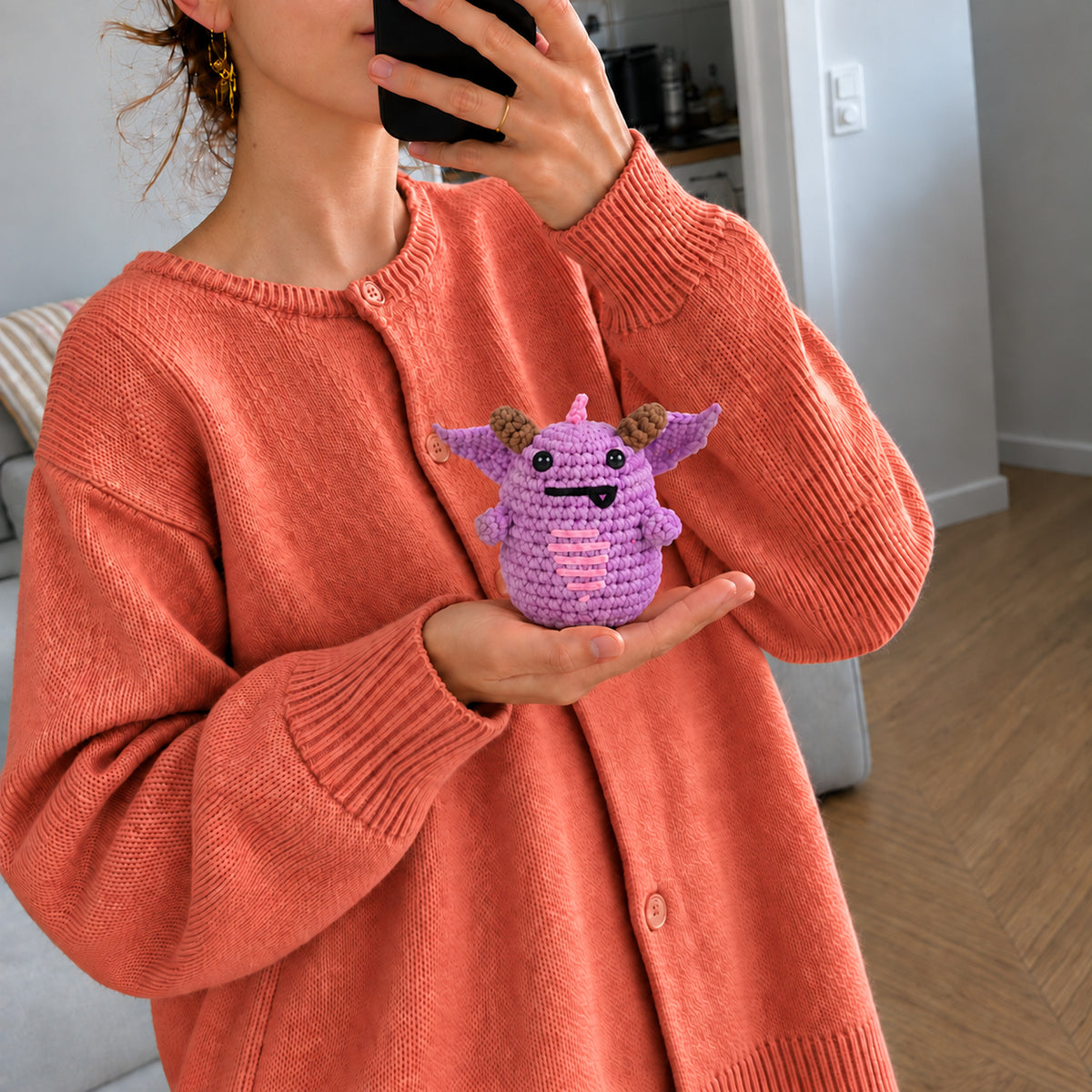 Lilac Little Dragon: a lilac dragon with small horns and wings, shown in hand