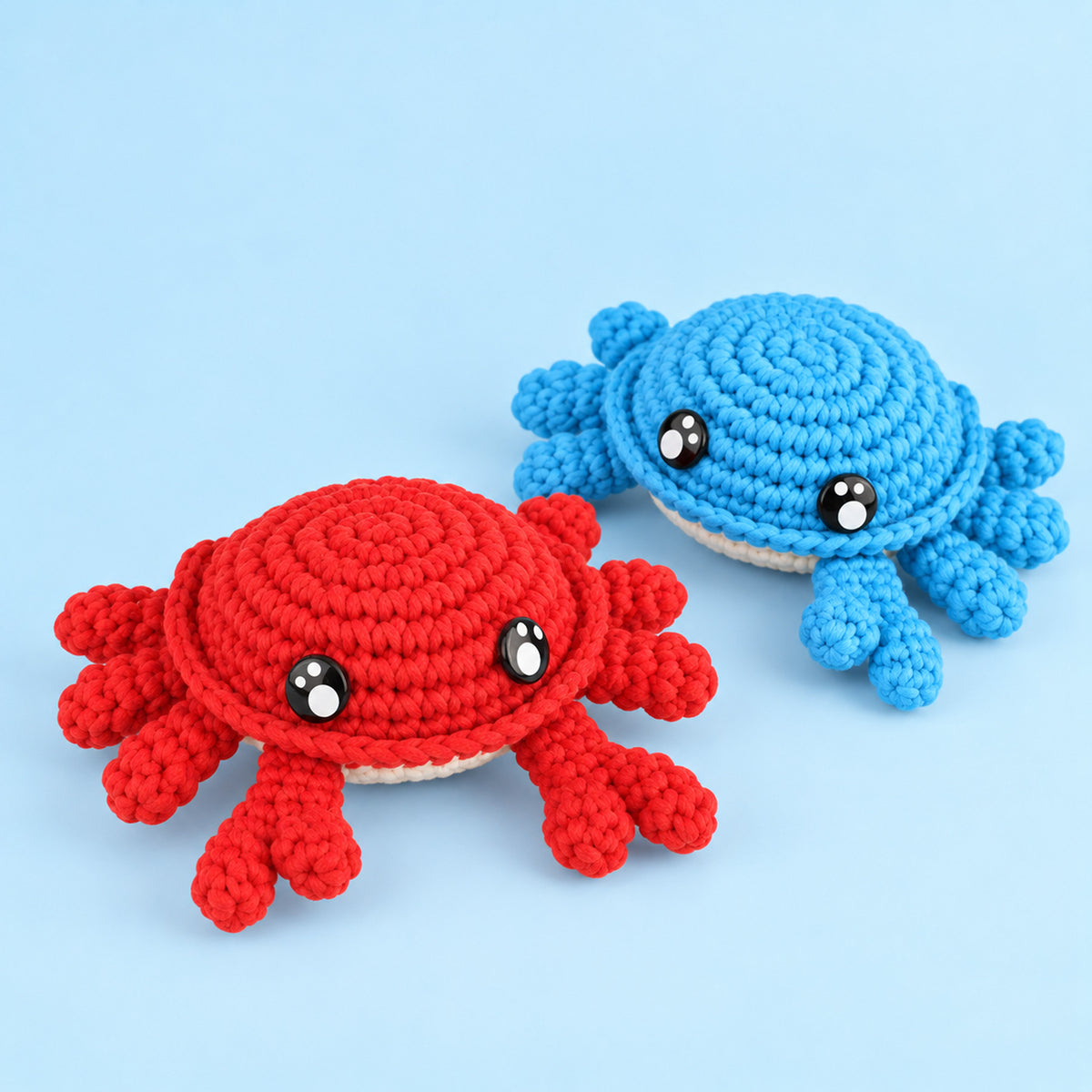 Little Tide Crab Duo: red and blue crabs with rounded bodies and small legs