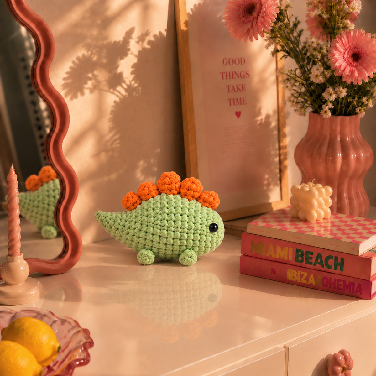 Meadow Stegosaurus: a green dinosaur with bright orange plates along its back, displayed in an interior setting