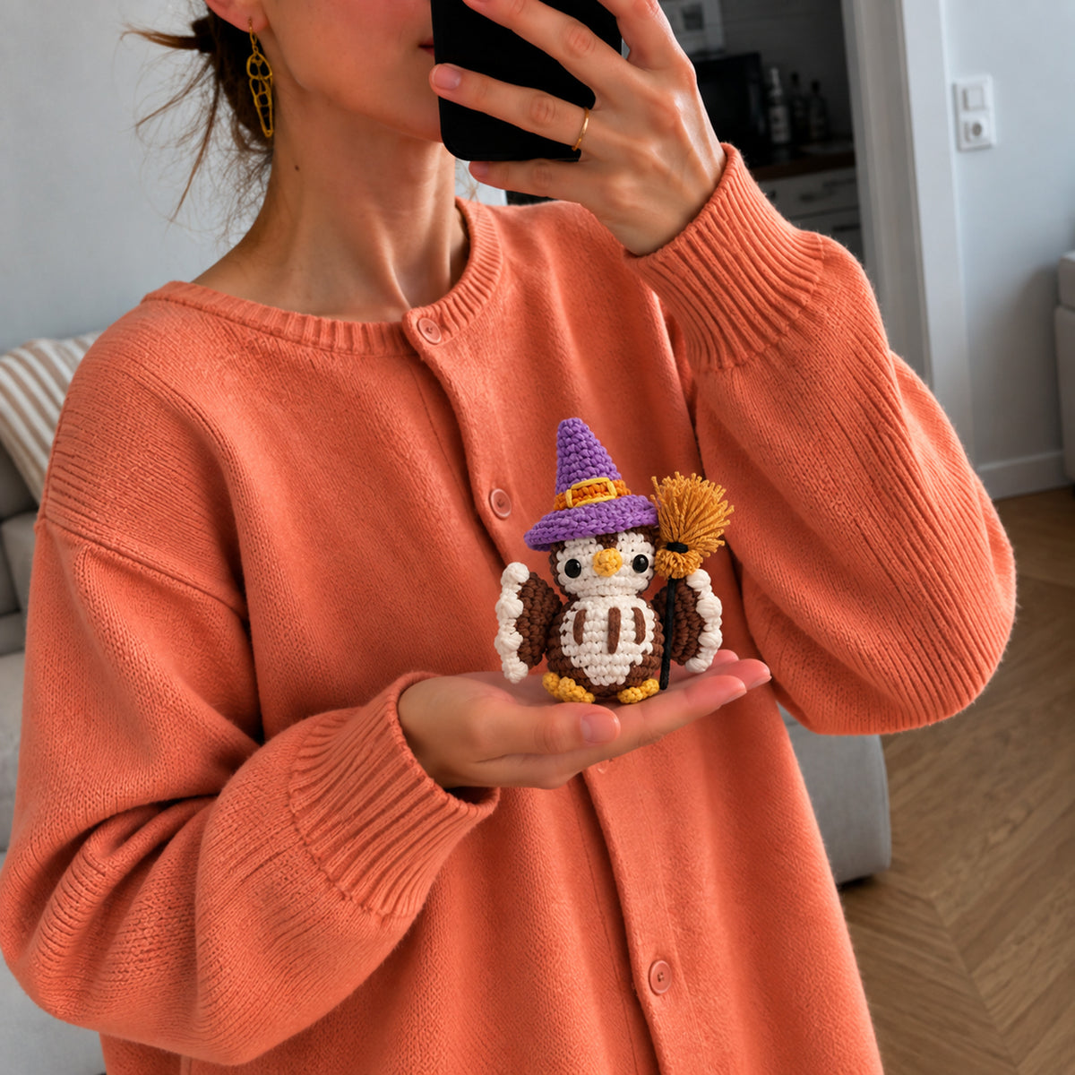 Moonspell Owl: a wide-eyed owl in a purple witch hat, complete with a little broom, shown in hand