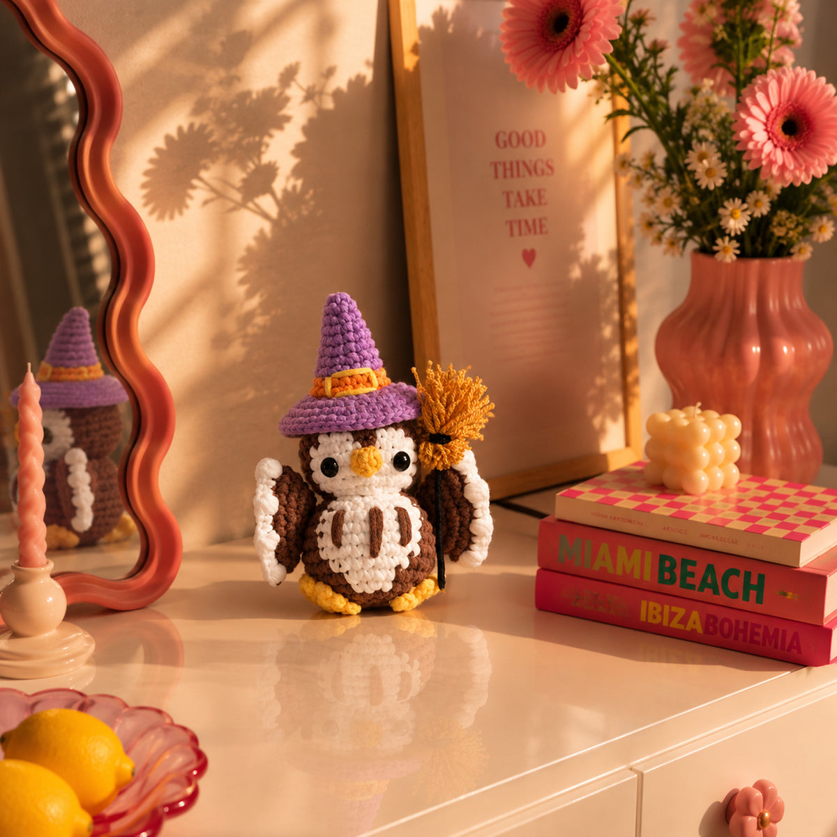Moonspell Owl: a wide-eyed owl in a purple witch hat, complete with a little broom, displayed in an interior setting
