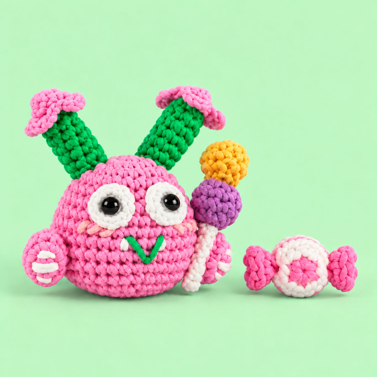 Petal Pop Monster: a pink round monster with colourful flower details