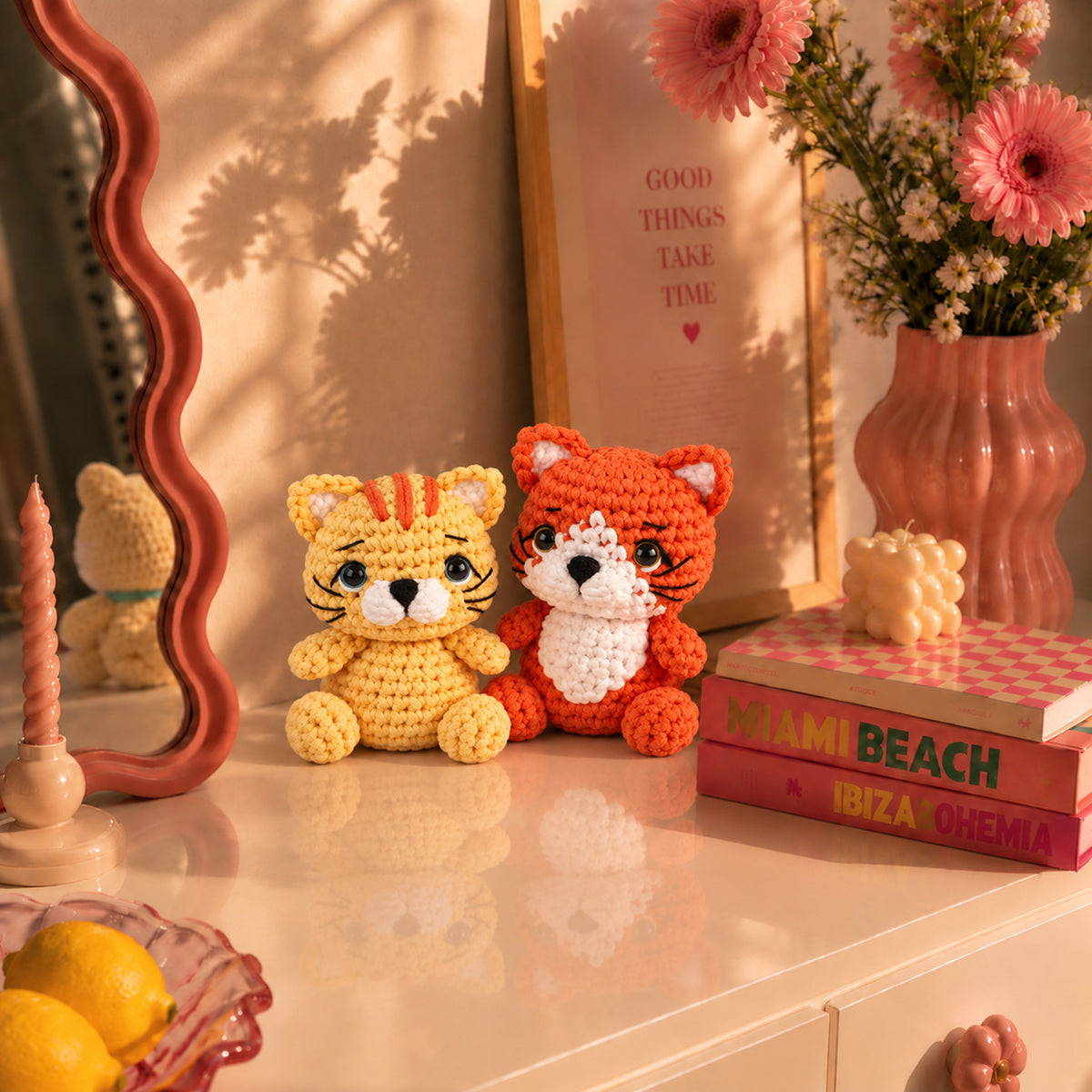 Pocket Fox and Cat: an orange fox and a golden cat with small embroidered details, displayed in an interior setting
