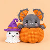 Pumpkin Moon Friends: a grey bat peeking from a pumpkin alongside a little witch ghost