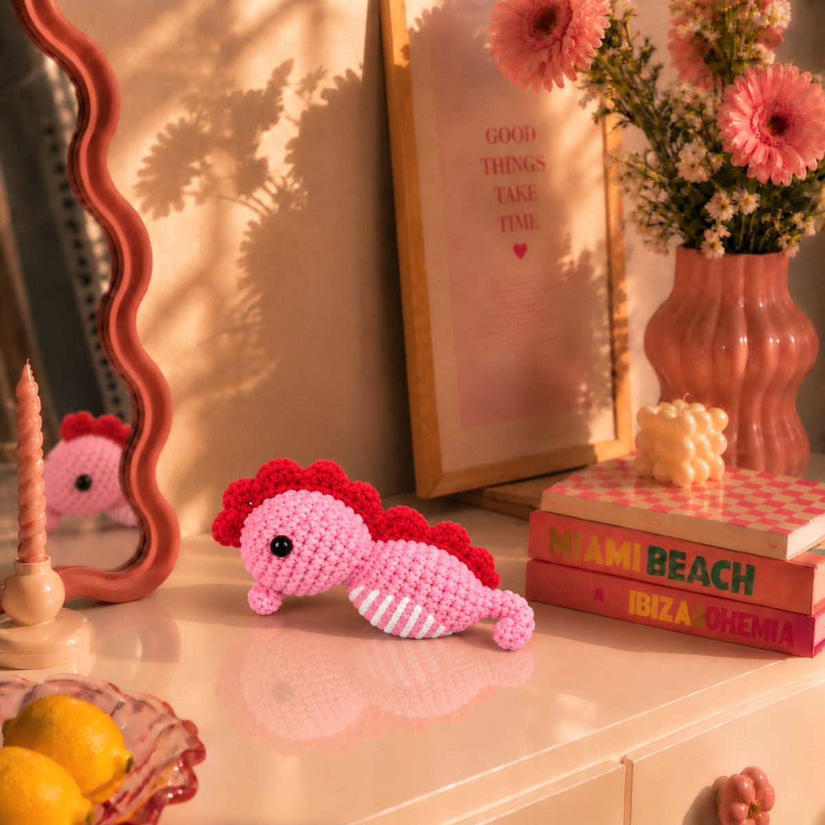 Rosy Seahorse: a pink seahorse with a deep rose crest and curved tail, displayed in an interior setting