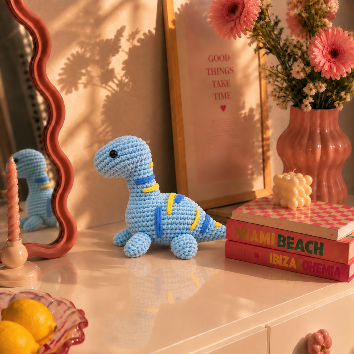 Sky Blue Longneck: a blue long-neck dinosaur with yellow stripes, displayed in an interior setting
