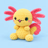 Sunbeam Axolotl: a yellow axolotl with pink gills and bright dark eyes