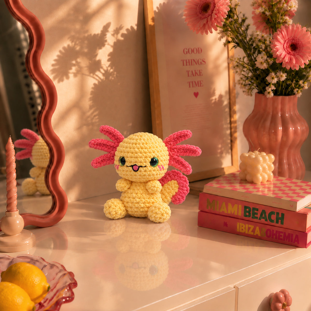 Sunbeam Axolotl: a yellow axolotl with pink gills and bright dark eyes, displayed in an interior setting