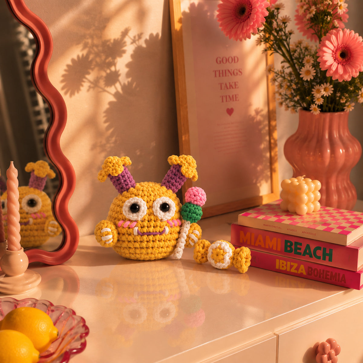 Sunny Pop Monster: a sunny yellow monster with colourful flower details, displayed in an interior setting