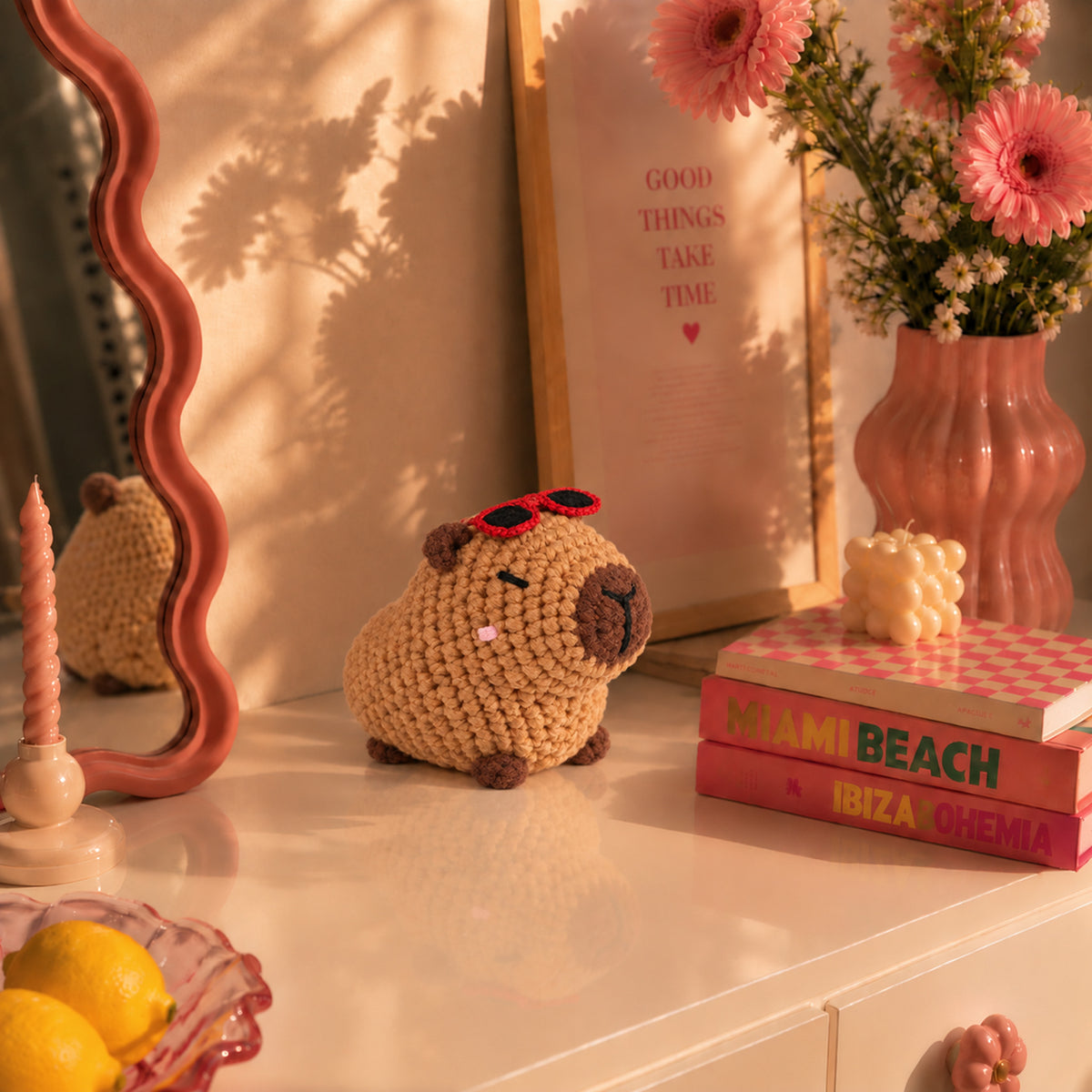 Sunset Capybara: a brown capybara wearing little red sunglasses, displayed in an interior setting