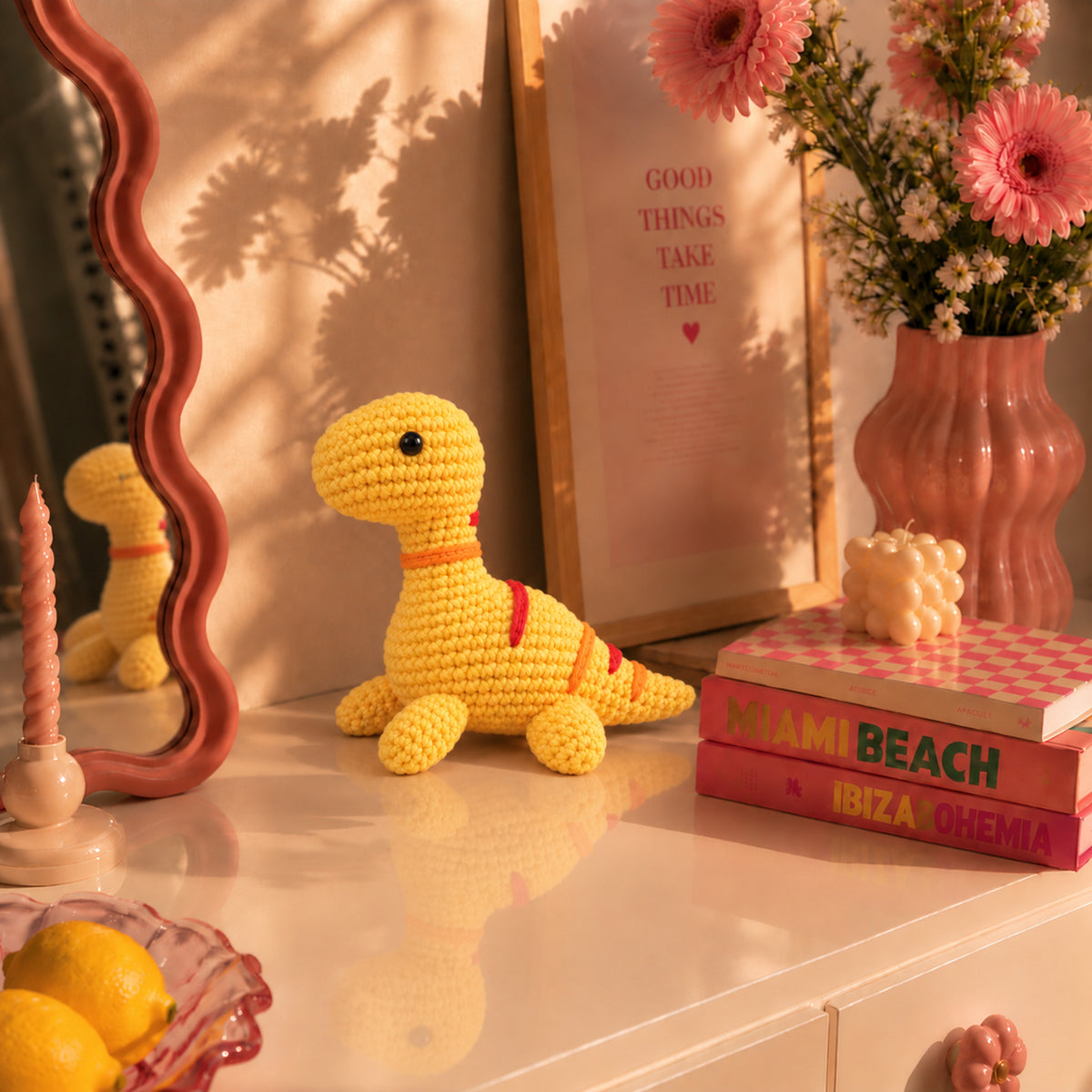 Sunshine Longneck: a yellow long-neck dinosaur with orange stripes, displayed in an interior setting