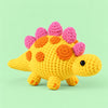 Sunshine Stegosaurus: a yellow dinosaur with bright orange and pink back plates