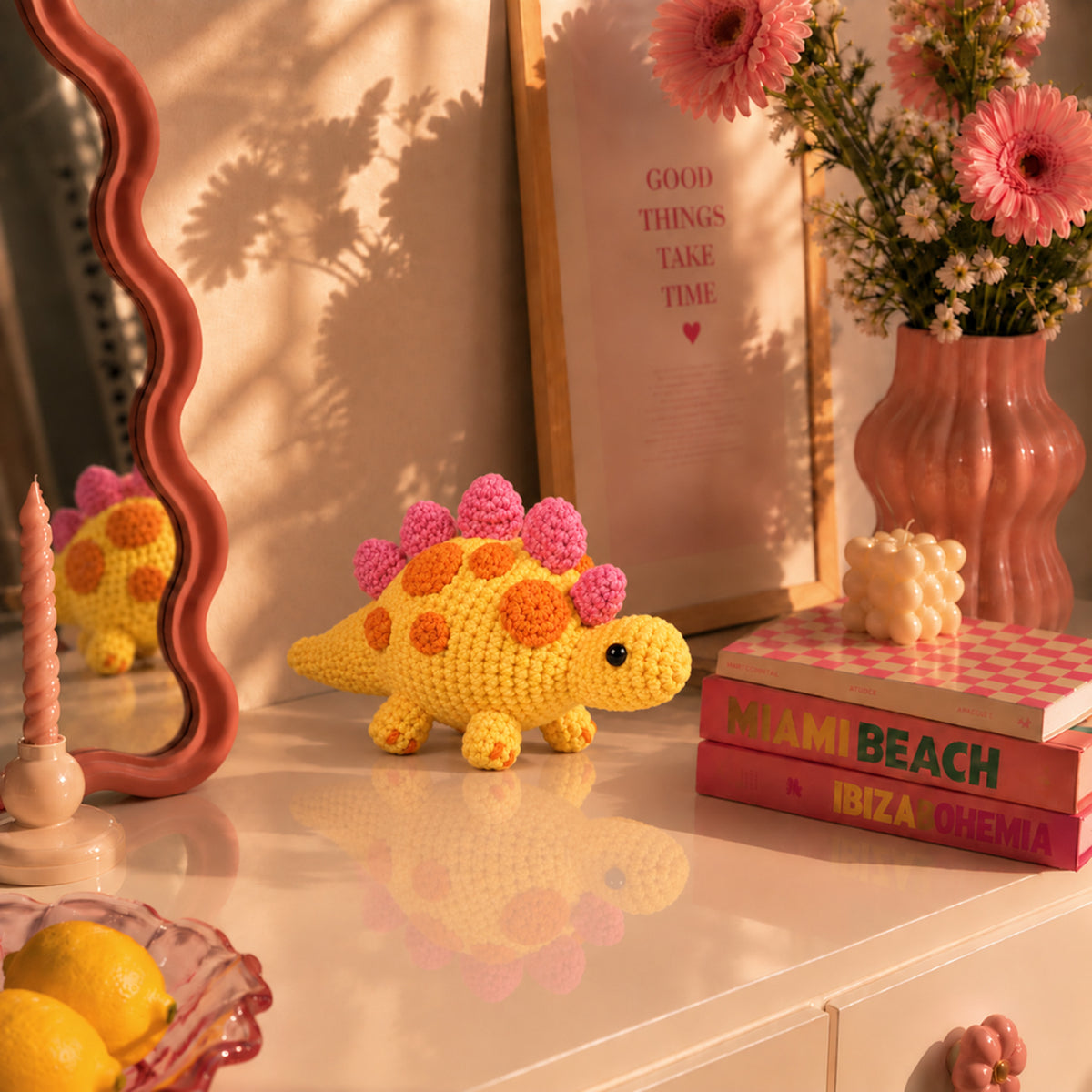 Sunshine Stegosaurus: a yellow dinosaur with bright orange and pink back plates, displayed in an interior setting