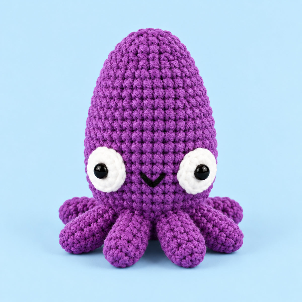 Violet Tide Cuttlefish: a violet cuttlefish with a rounded head and smiling face