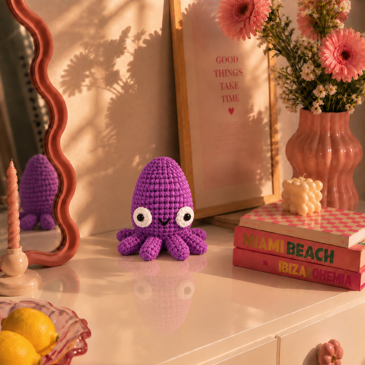 Violet Tide Cuttlefish: a violet cuttlefish with a rounded head and smiling face, displayed in an interior setting
