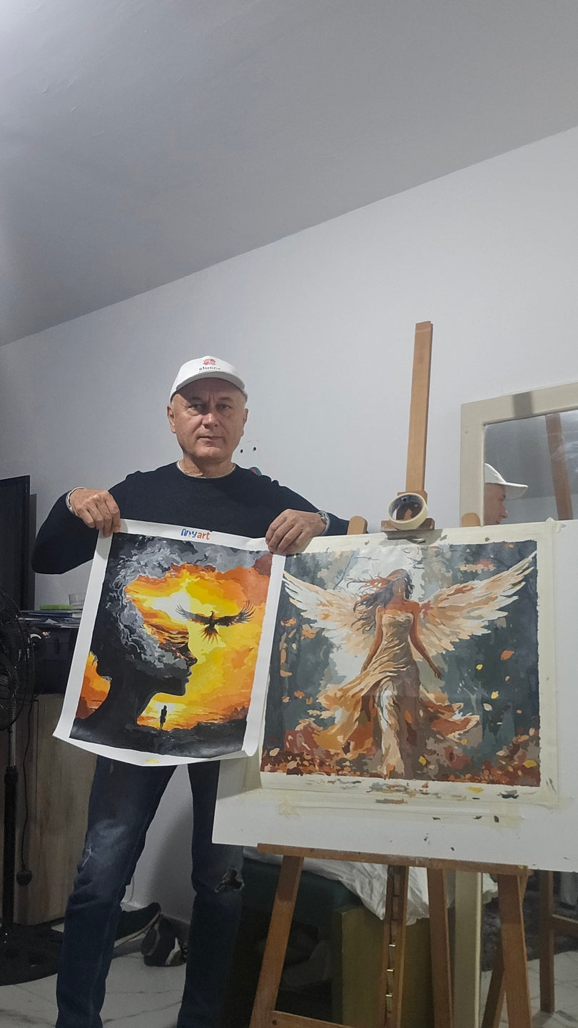 Painter standing beside a yellow and black artwork