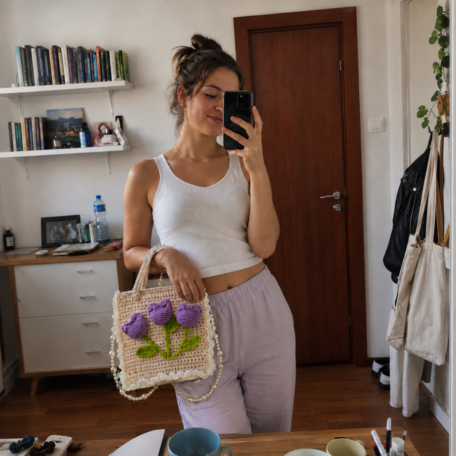 Crafter showing a pink handmade bag
