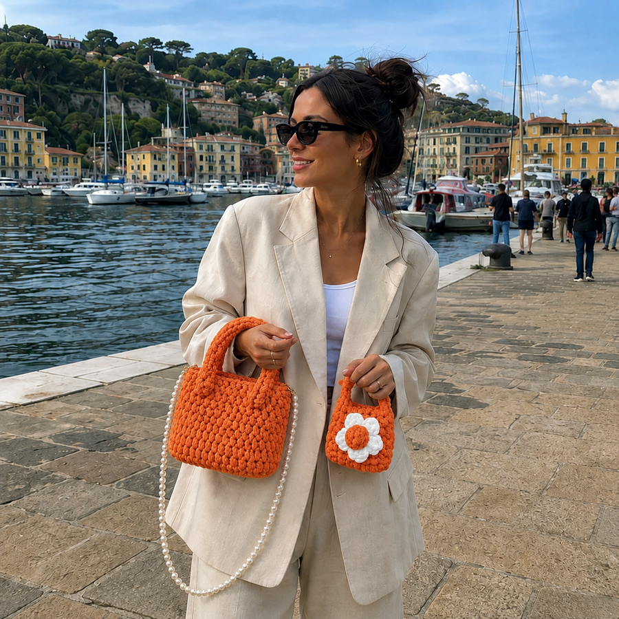 Crafter carrying an orange handmade bag