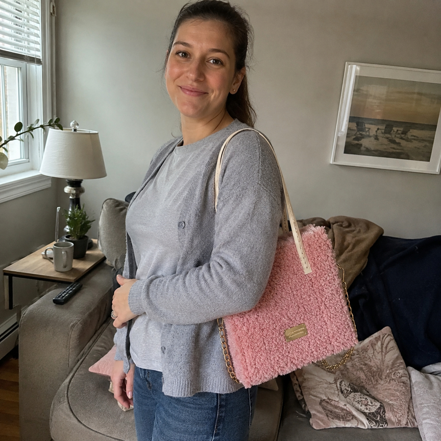 Crafter showing a pink handmade bag